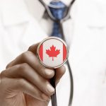 SMBA | SMA News Today | Research | Doctor holds a stethoscope showing Canadian flag