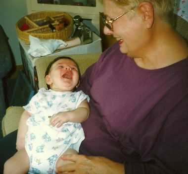 losing a parent | SMA News Today | photograph of older woman with an infant in her lap