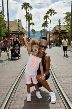 cure sma | SMA News Today | Céline and Amer-Joi pose for a photo at what looks like Disneyland
